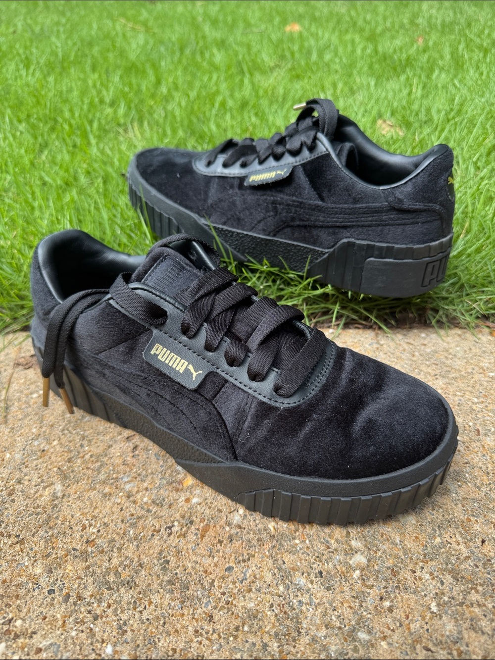 Puma Black Velvety Suede Platform Sneakers with gold accents
